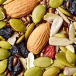 a trail mix with almonds, sunflower seeds, pumpkin seeds and goji berries