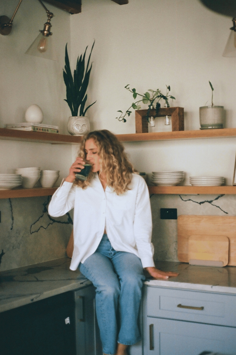 Woman in her kitchen sharing how she is proactively supporting her fertility and reproductive health at age 35.